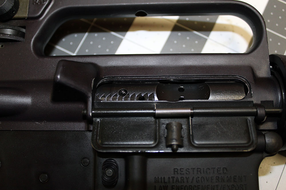detail shot of the right side upper receiver, with the bolt visible through the open ejection port